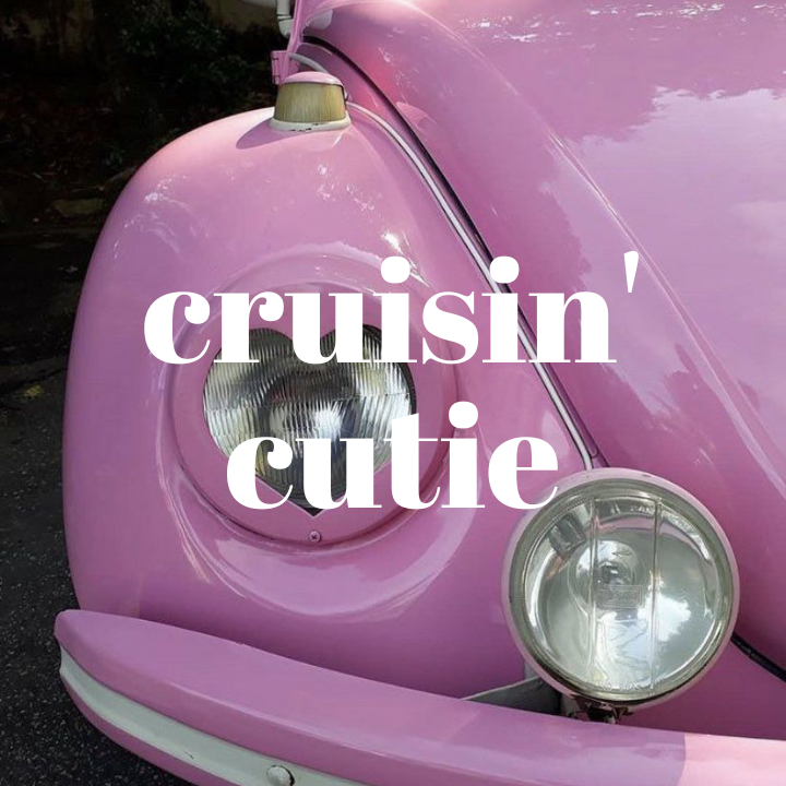 close up view of pink VW beetle with "cruisin cutie" text overlay