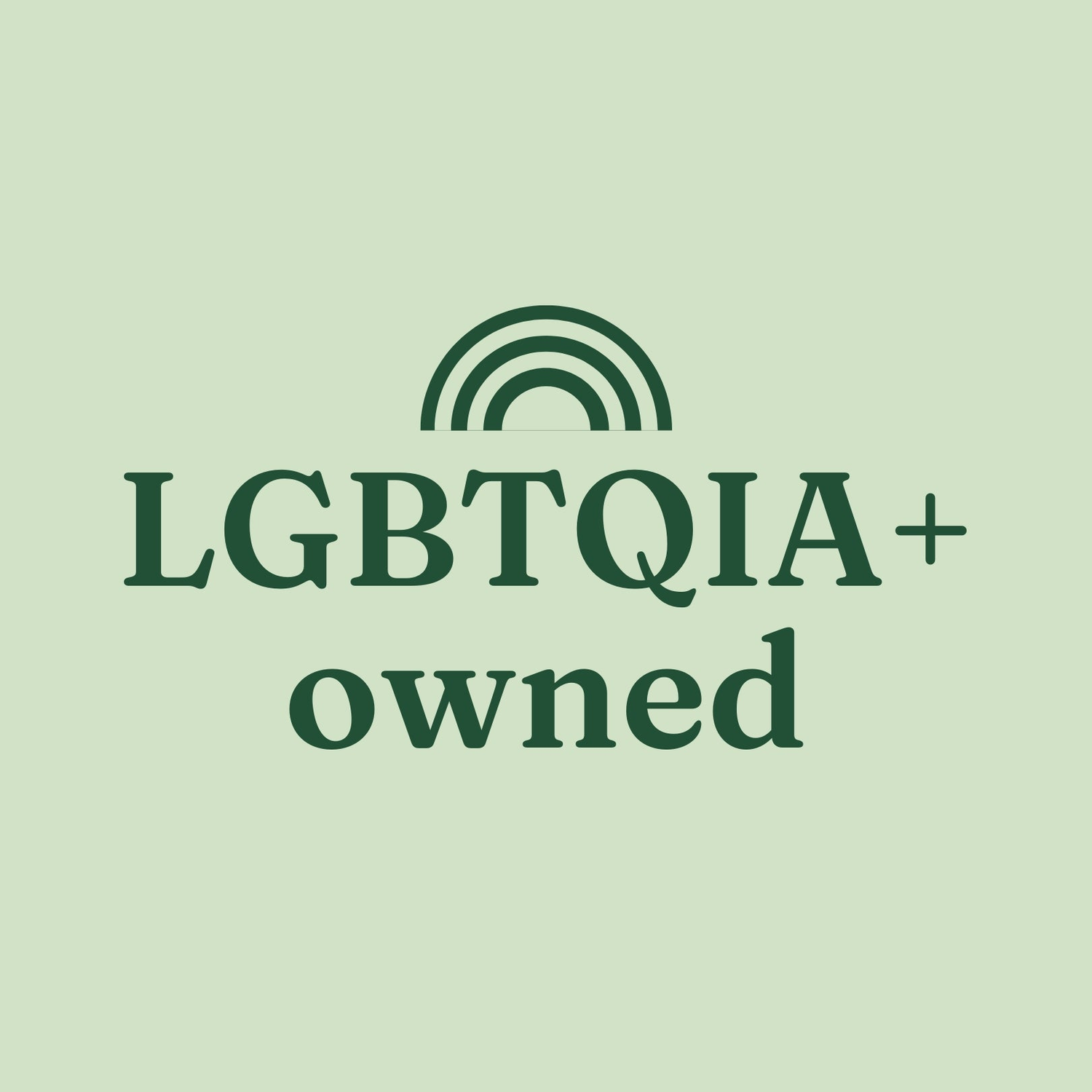 Pink pill-shape containing a white rainbow and the phrase "LGBTQIA+ owned"