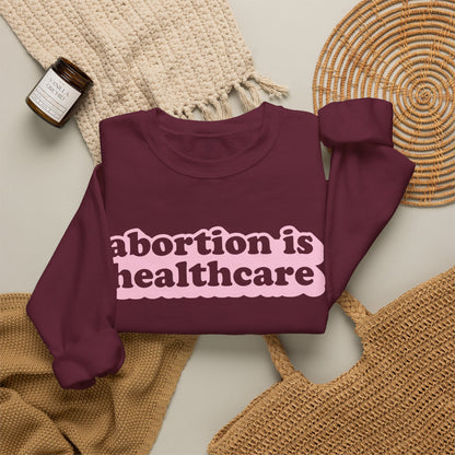 Sweatshirt - Abortion Is Healthcare (Light Pink)