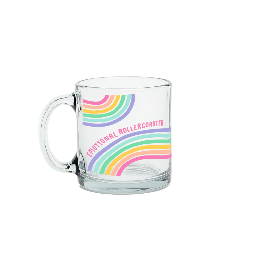 product shot of clear mug with wavey rainbows with the saying "emotional rollercoaster" in pink