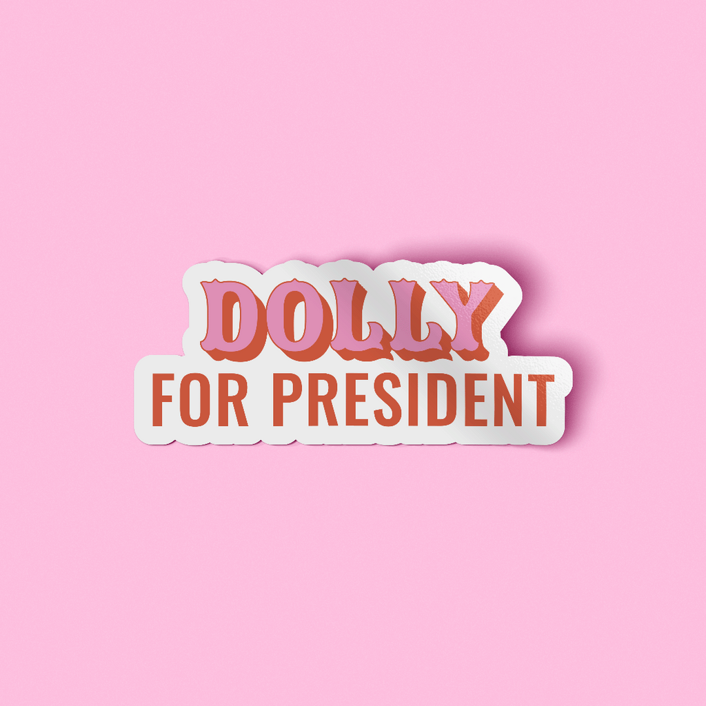 WOW Original decorative sticker that says "Dolly For President" in red and pink font. The sticker is placed on a light pink background. 