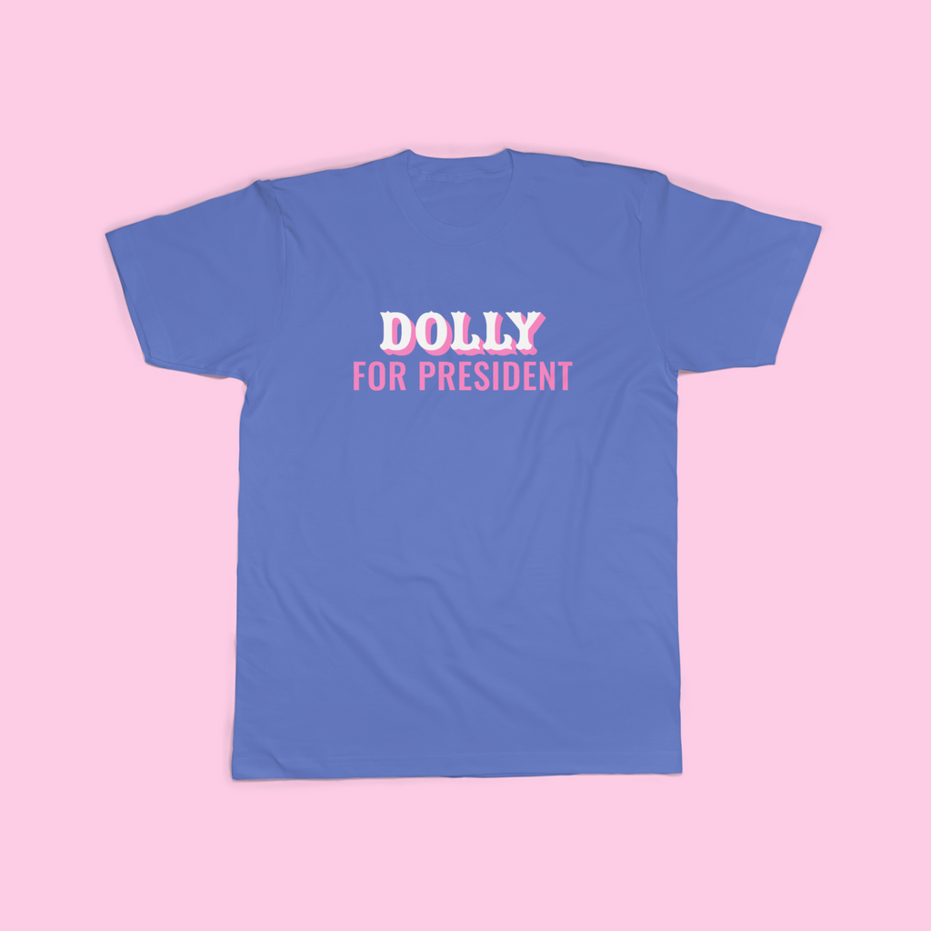 Blue Comfort Colors short sleeve t-shirt with the phrase "Dolly For President" in pink and white text centered on the shirt.