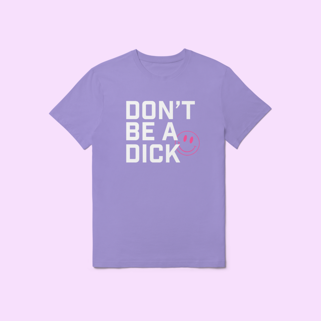 Front of WOW Original graphic t-shirt in light purple that says "Don't be a dick" in white text with a hot pink smiley face poking out from behind the text.