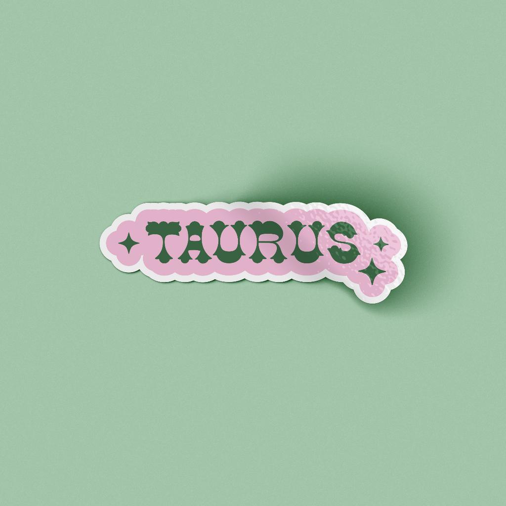 Pink sticker design with word TAURUS and star symbol in both side