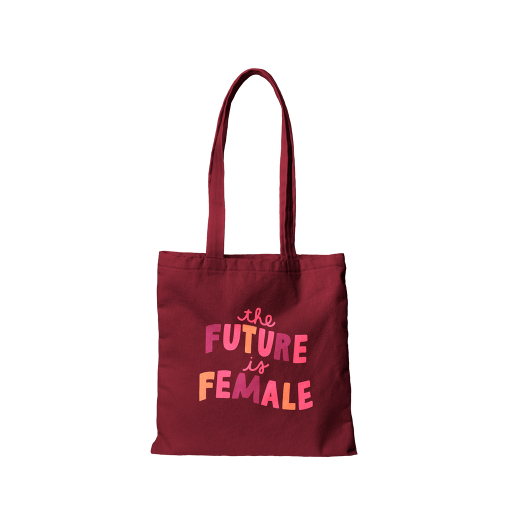 flat lay shot of burgundy canvas bag featuring the phrase "The Future Is Female"